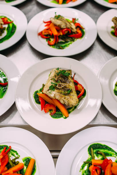 istock Meat dish with vegetables for catering. Lots of plates. 1281489871