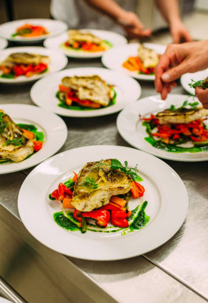 istock Meat dish with vegetables for catering. Lots of plates. 1281489875