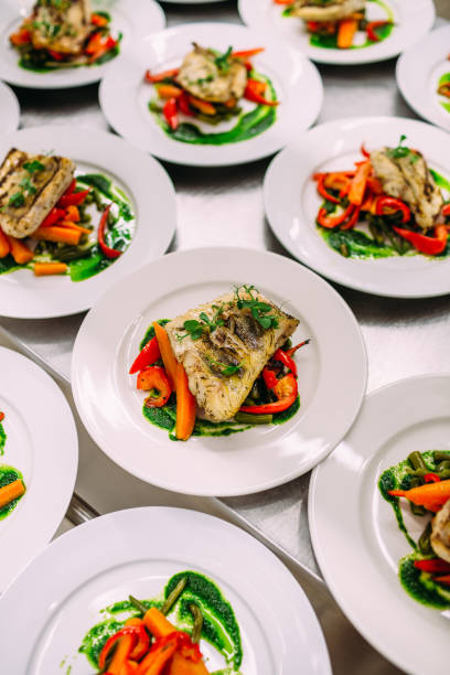 istock Meat dish with vegetables for catering. Lots of plates. 1281489879
