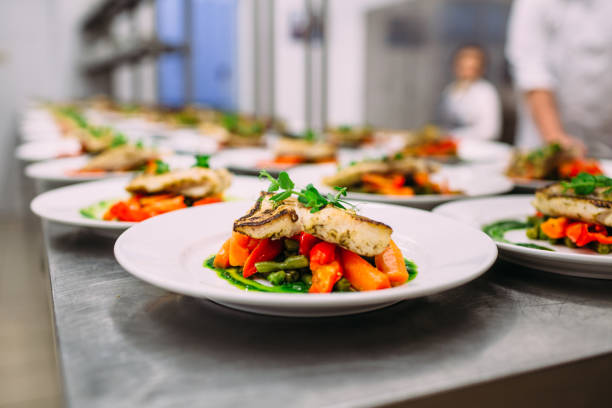 istock Meat dish with vegetables for catering. Lots of plates. 1281489880