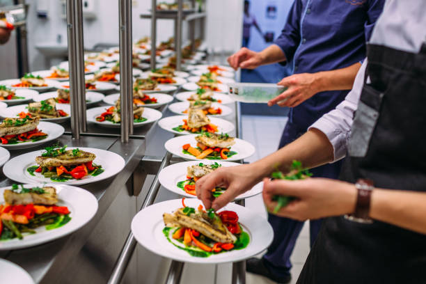 istock Meat dish with vegetables for catering. Lots of plates. 1281489883