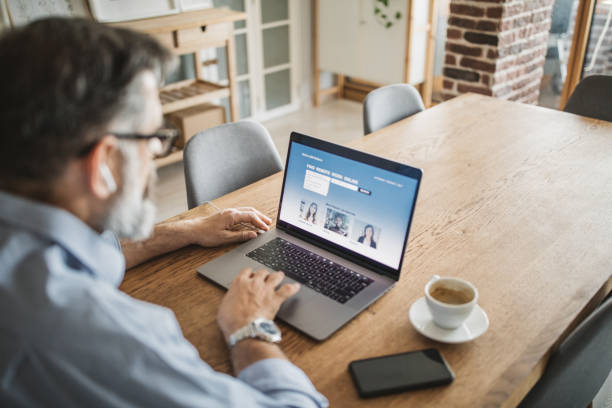 Working during isolation period Mature men at home during pandemic isolation have conference  call one mature man only audio stock pictures, royalty-free photos & images