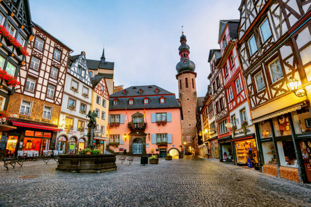 Colorful half-timbered houses in Cochem, Germany Cochem, Germany - October 08 2018: Colorful half-timbered houses in historical medieval Old Town of Cochem are a popular tourist attraction in Moselle river valley, Germany rhineland palatinate photos stock pictures, royalty-free photos & images