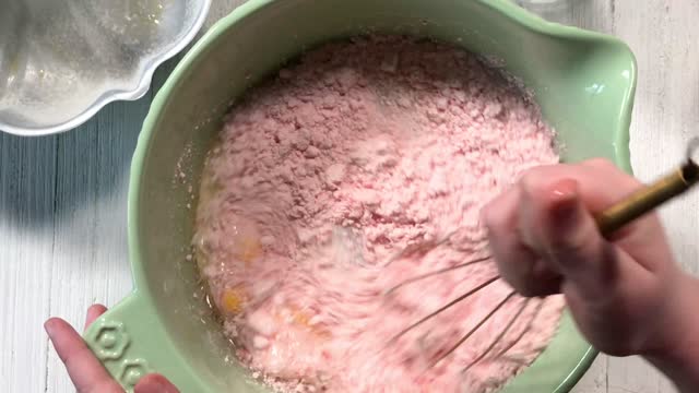 adding ingredients and cracking eggs in top view