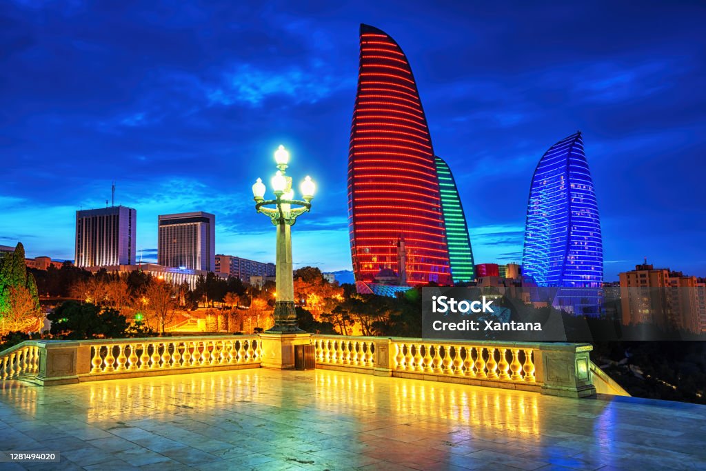 Baku city night view, Azerbaijan Baku, capital city of Azerbaijan, night skyline with Flame Towers building illuminated in Azerbaijan national flag colors Baku Stock Photo