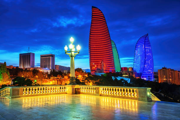 Baku city night view, Azerbaijan Baku, capital city of Azerbaijan, night skyline with Flame Towers building illuminated in Azerbaijan national flag colors azerbaijan stock pictures, royalty-free photos & images