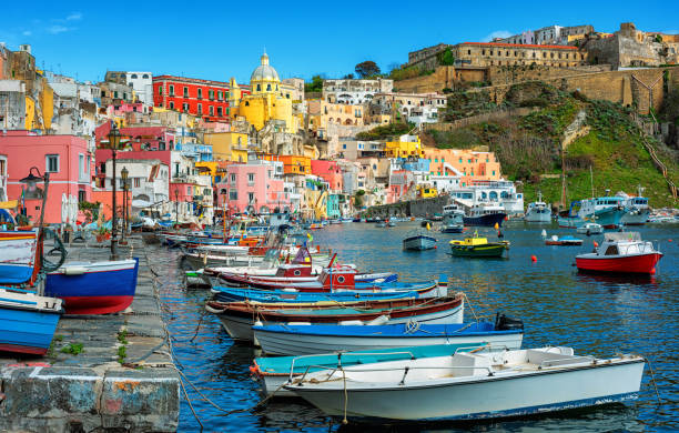 Colorful houses in port of Marina di Corricella, the oldest fishing village of Procida island, Naples, Italy