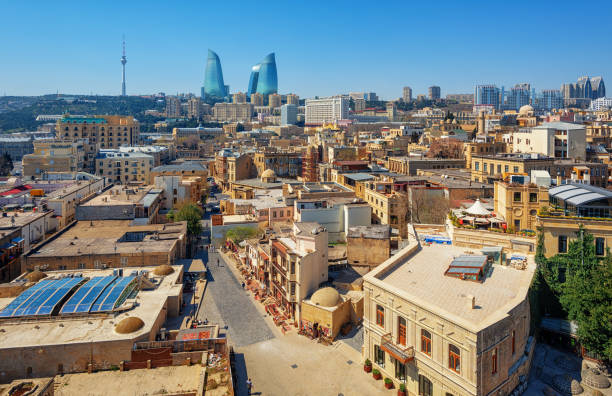 Baku city, the Old town and modern skyline, Azerbaijan Baku city, aerial view over the Old town and modern skyline with iconic Flame Towers building, Azerbaijan baku stock pictures, royalty-free photos & images
