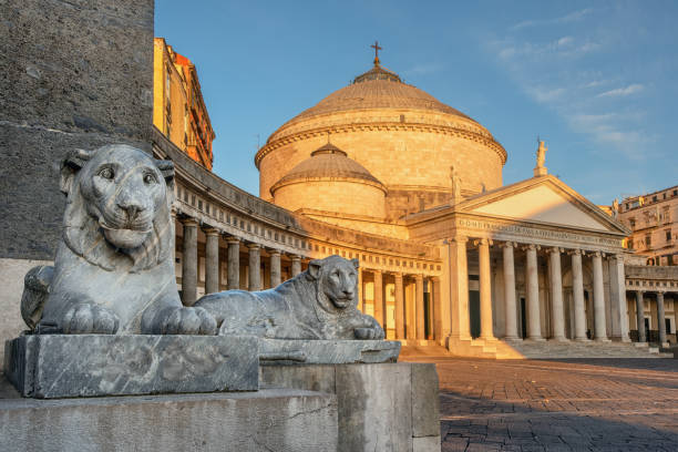 San Francesco da Paola church, Naples, Italy Naples, Italy, view of Basilica Reale Pontificia San Francesco da Paola church on Piazza del Plebiscito, main square of the city, and stone lion sculptures on sunrise naples italy photos stock pictures, royalty-free photos & images