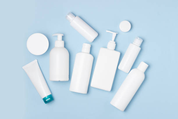 istock White plastic cans on a blue background. Cosmetics for skin care. Detergents, disinfectants and laundries 1281495821