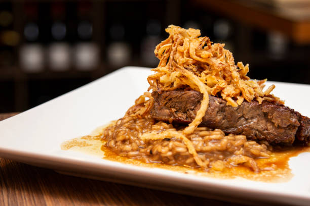 istock Argentine Chorizo steak, with risotto and caramelized fried onion 1281496893