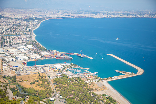 Aerial view of beautiful blue Gulf of Antalya, Konyaalti beach and popular seaside resort city Antalya in Turkey