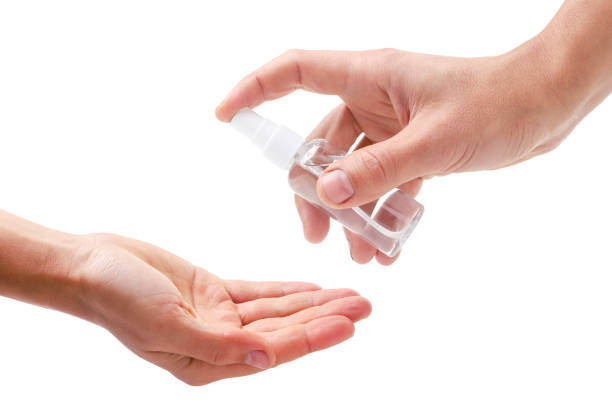 istock Antiseptic gel in a plastic bottle and hands on a white background. Isolated 1281501663