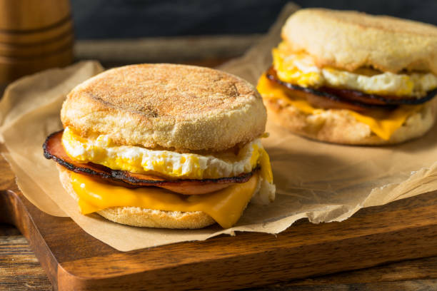 Homemade Egg English Muffin Sandwich Homemade Egg English Muffin Sandwich with Bacon and Cheese breakfast stock pictures, royalty-free photos & images