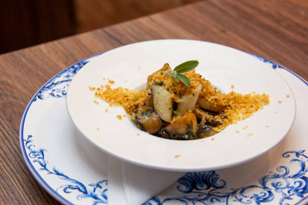 istock Grilled squid with mushrooms and bread loaf 1281502996