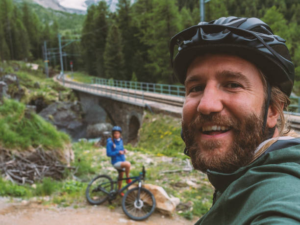 istock Mountain bikers taking selfie on trail 1281504459