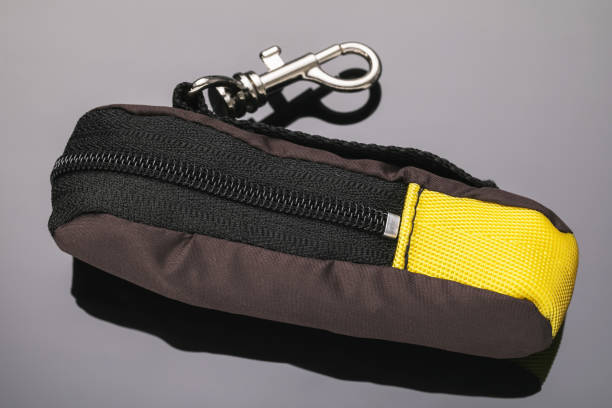 istock Brown handbag for a fingerboard on a gray background, close-up 1281504730