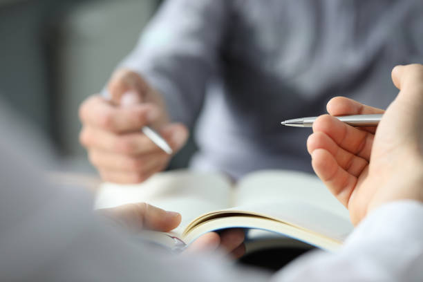 istock Two business partners are going to sign contract 1281507193