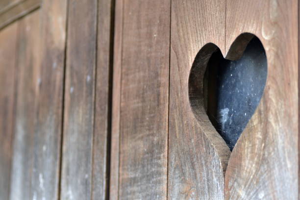 istock Heart shape in wooden door 1281507525