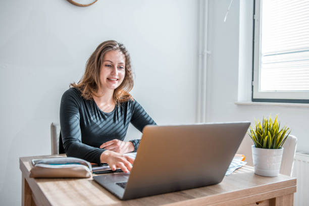istock Caucasian Female Student Learning At Home Using Laptop 1281507712