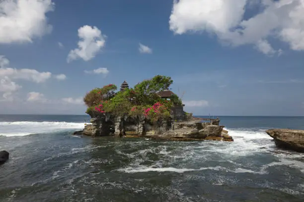 Photo of Tanah Lot water temple in Bali. Indonesia nature landscape. Tanah Lot temple in daylight, Bali island. Popular temple of Bali, Indonesia landmark