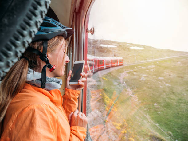 istock Mountain biker on Swiss train getting a ride up the mountain 1281509021