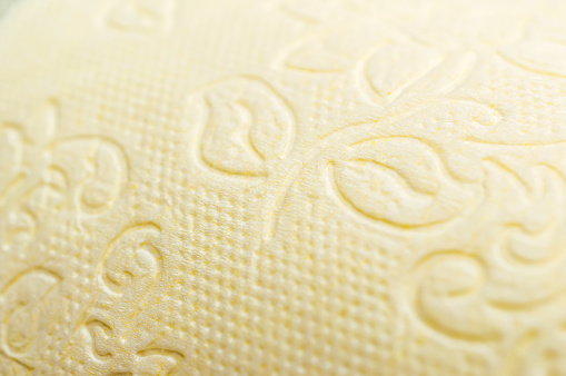 Yellow paper towel (toilet paper) texture.