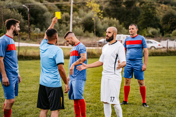 istock Soccer referee showing yellow card 1281510839