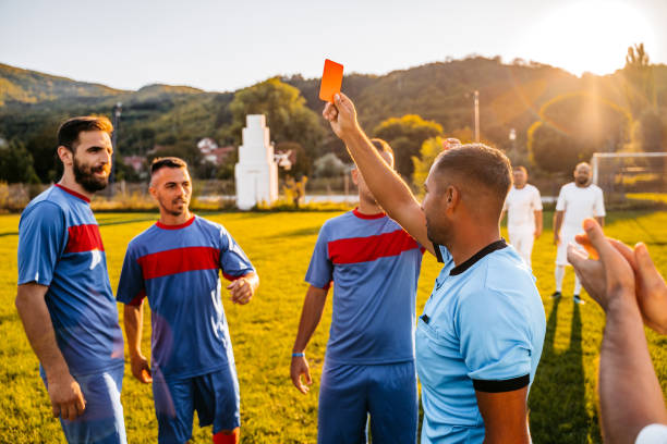 istock Soccer referee showing red card 1281510892