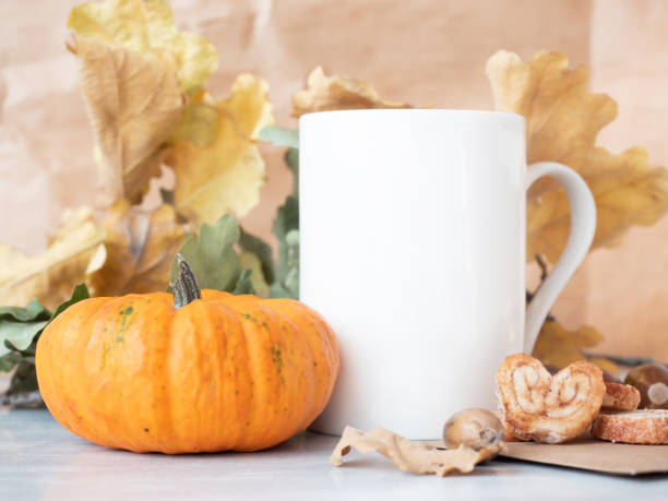 istock Closeup of White tea cup on autumn background 1281511551