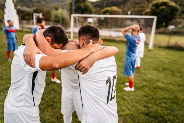 istock Soccer players  celebrating a goal 1281512080