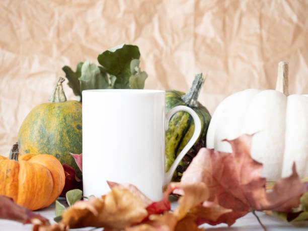 istock Closeup of White tea cup on autumn background 1281512102