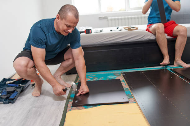 istock Father and son assembling furniture in new home 1281512748