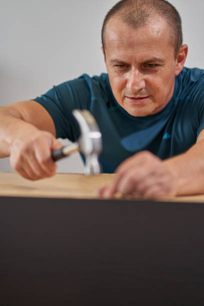 istock Man assembling his new furniture 1281512774