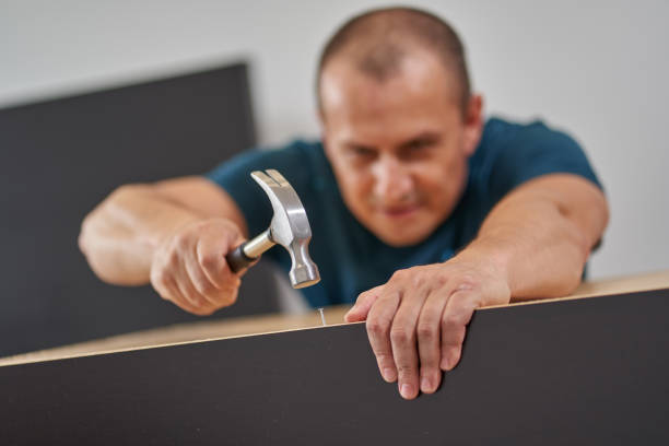 istock Man assembling his new furniture 1281512780