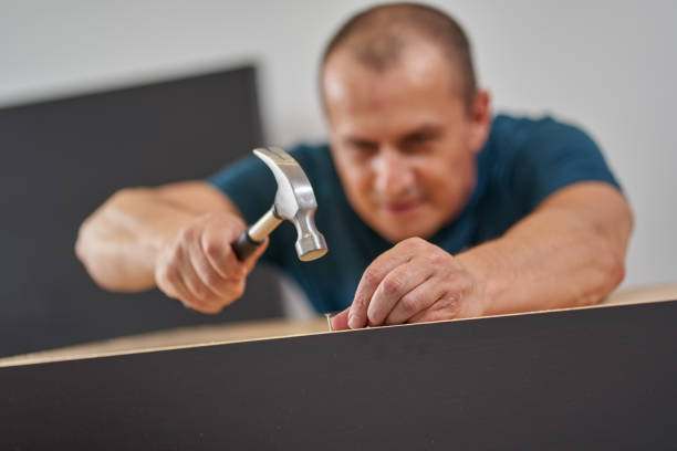 istock Man assembling his new furniture 1281512792