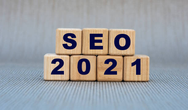 istock SEO 2021 - word on wooden cubes on a gray background 1281512906