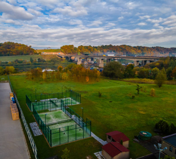 istock Aerial panoramic view of paddle tennis courts 1281513912