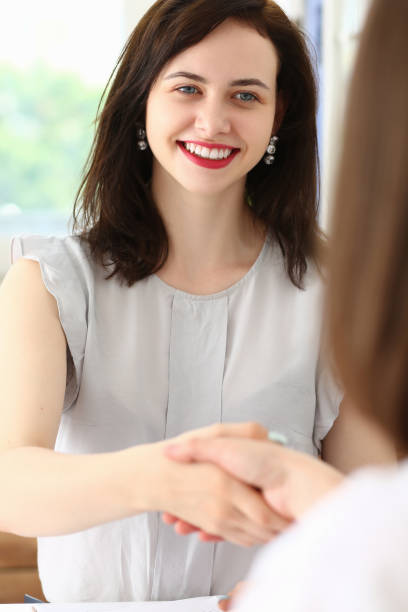 istock Business partners shaking hands after their meeting 1281514054
