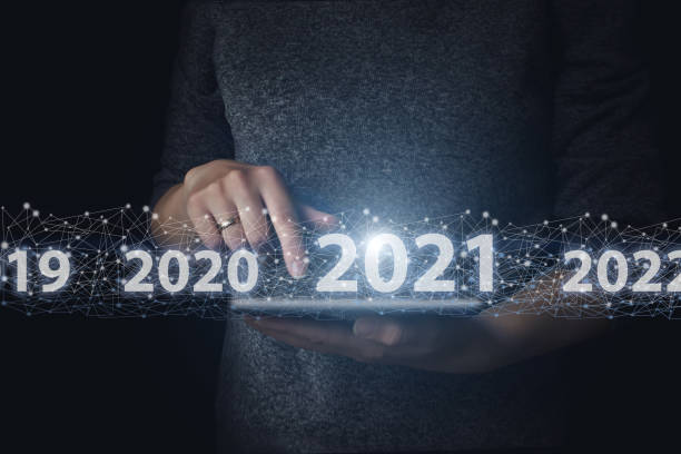 istock Hand touching global network on tablet with virtual hologram 2021 year. The concept of communication and internet of things. 1281514075
