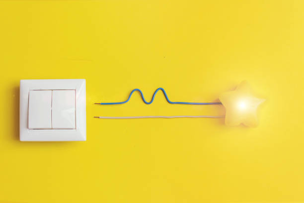 istock white switch and yellow glowing star with wires phase, zero, ground, uniqueness concept. Idea, innovation, creativity concept. 1281514081