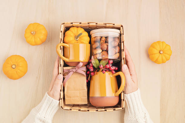 istock Preparing care package for thanksgiving, sasonal gift box with cup, tea or coffee package and cookies 1281515316