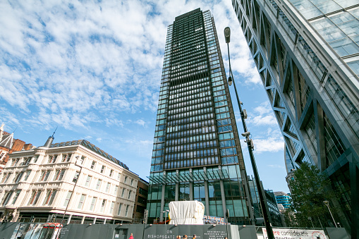 One Bishopsgate Plaza in London, England. The two towers contain a hotel and retail and residential space. This property is commercially owned and managed in the City of London. People can be seen in the foreground.