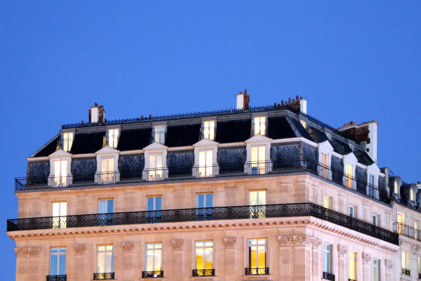 istock Apartment building in downtown Paris in the early evening. 1281518154