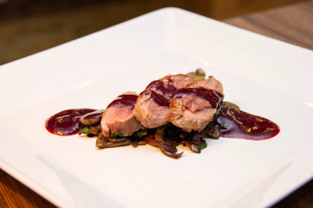 istock Duck breast with red fruit sauce and mushroom 1281520913