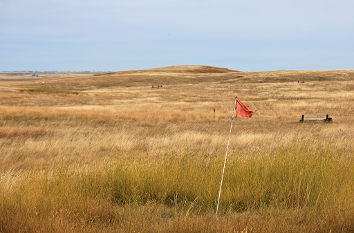 An abandonded golf course with ball washer on the great plains. Prairie golf course in Saskatchewan.