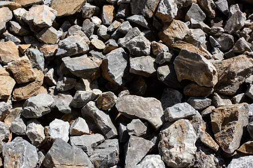 Gray large karst rock stones and debris background
