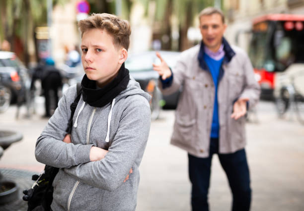 istock Upset teenage boy scolded by father 1281524066