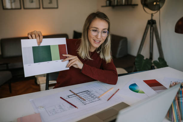 istock Female designer is brainstorming ideas, deciding which color palette to use 1281527293
