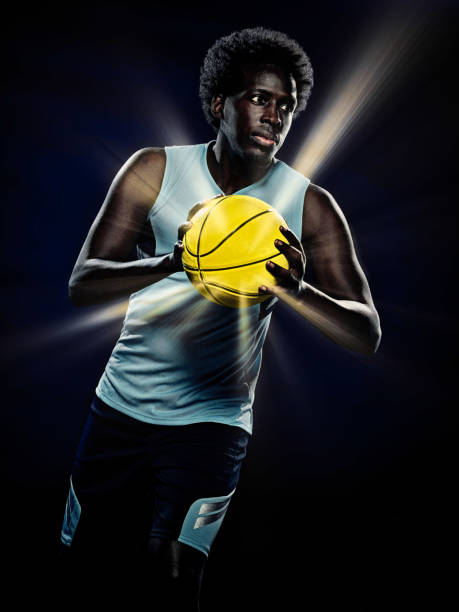 istock young african basketball player man isolated black background 1281528193